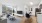 a living room with a tv and chairs