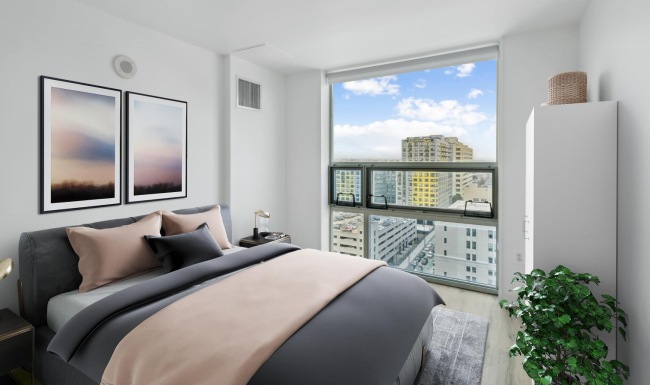 a room with a window and a bed