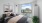a room with a window and a bed